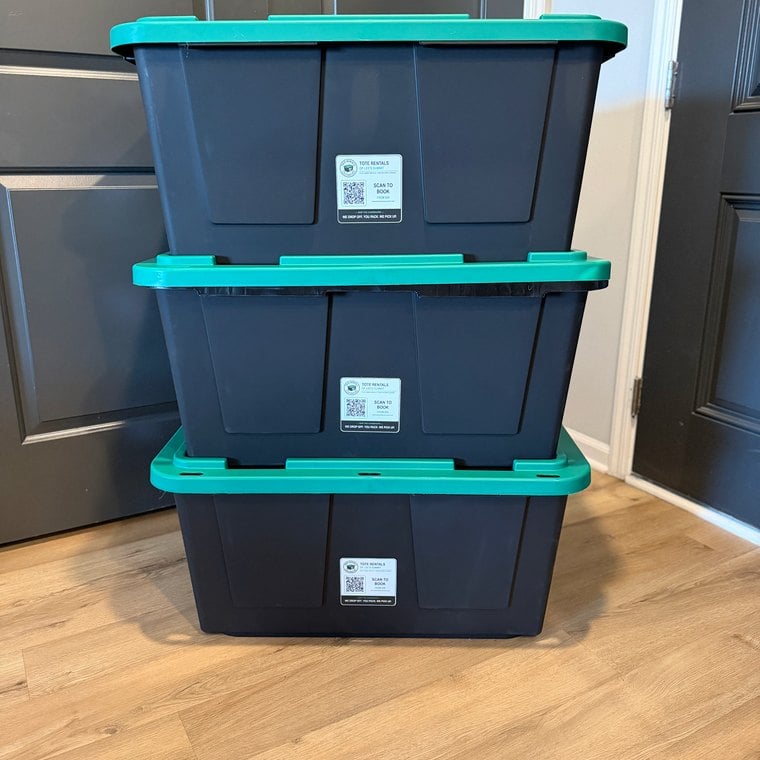 Clean stack of moving totes in a home